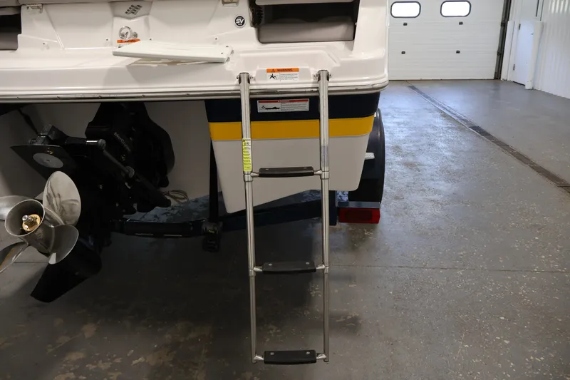 Slide: The Image of 2017 Four Winns H190 boat with ladder and propeller in a garage. - 49