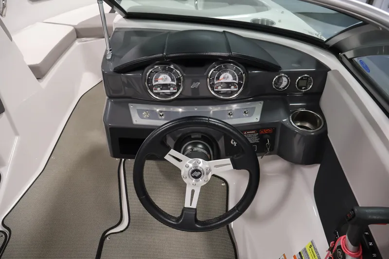 Slide: The Image of 2017 Four Winns H190 boat dashboard with steering wheel and instrument panel. - 18