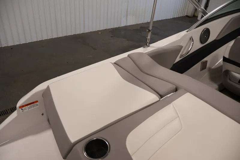 Slide: The Image of 2017 Four Winns H190 boat interior with cushioned seating and cup holder. - 45