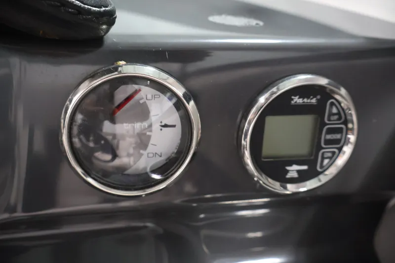 Slide: The Image of Dashboard of a 2017 Four Winns H190 boat with trim gauge and digital display. - 25