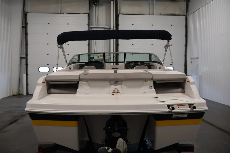 Slide: The Image of 2017 Four Winns H190 boat in a garage, rear view with canopy. - 6