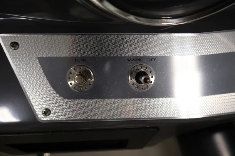 Slide: The Image of Control panel of a 2017 Four Winns H190 boat with horn and navigation lights. - 21