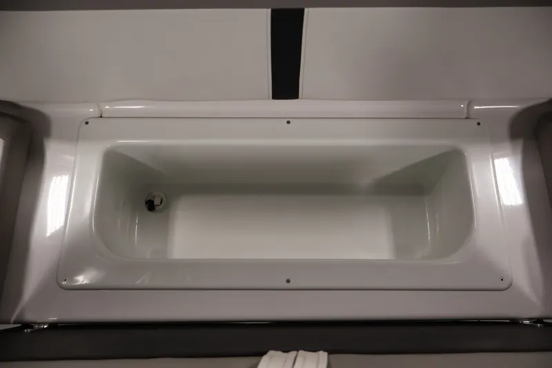 Slide: The Image of Storage compartment in a 2017 Four Winns H190 boat, featuring a sleek white interior. - 37