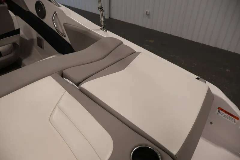 Slide: The Image of Interior seating of a 2017 Four Winns H190 boat, featuring beige upholstery. - 47