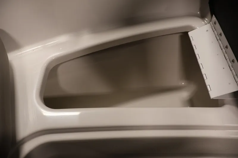 Slide: The Image of Interior compartment of 2017 Four Winns H190 boat, showcasing storage space. - 16