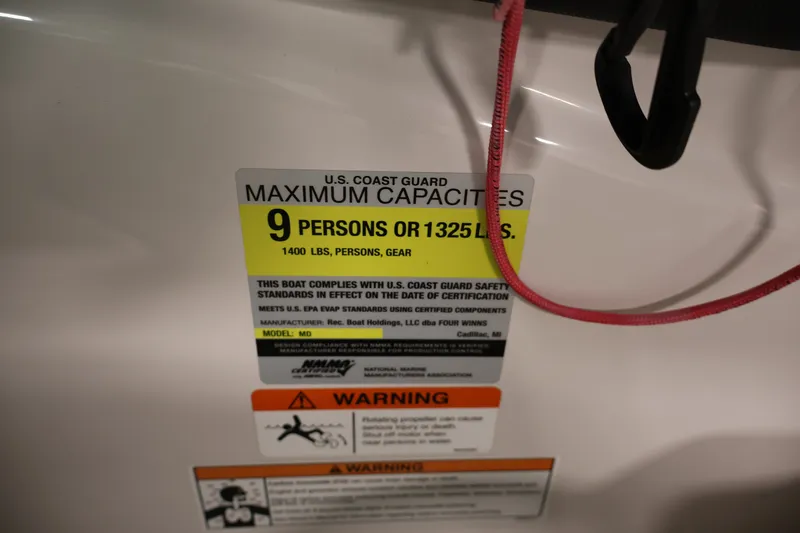Slide: The Image of 2017 Four Winns H190 capacity label, maximum 9 persons or 1325 lbs, safety warnings visible. - 26