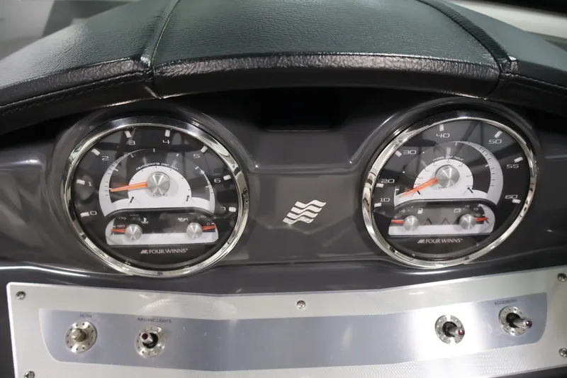 Slide: The Image of Dashboard of a 2017 Four Winns H190 boat with speedometer and tachometer gauges. - 20
