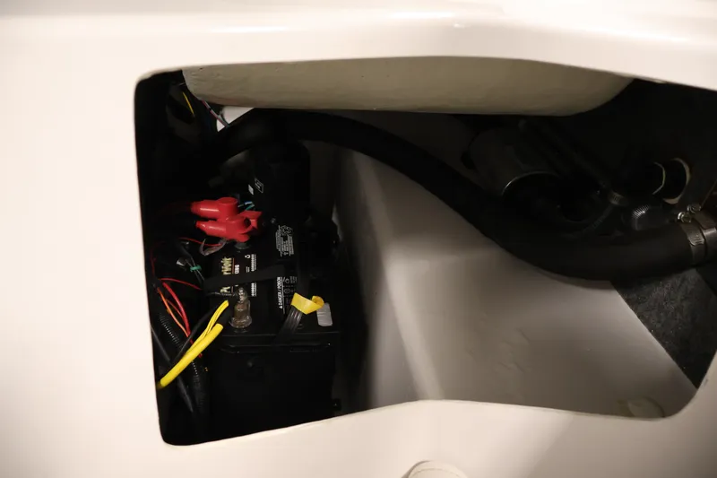 Slide: The Image of Battery compartment of 2017 Four Winns H190 boat, showing wiring and connections. - 43