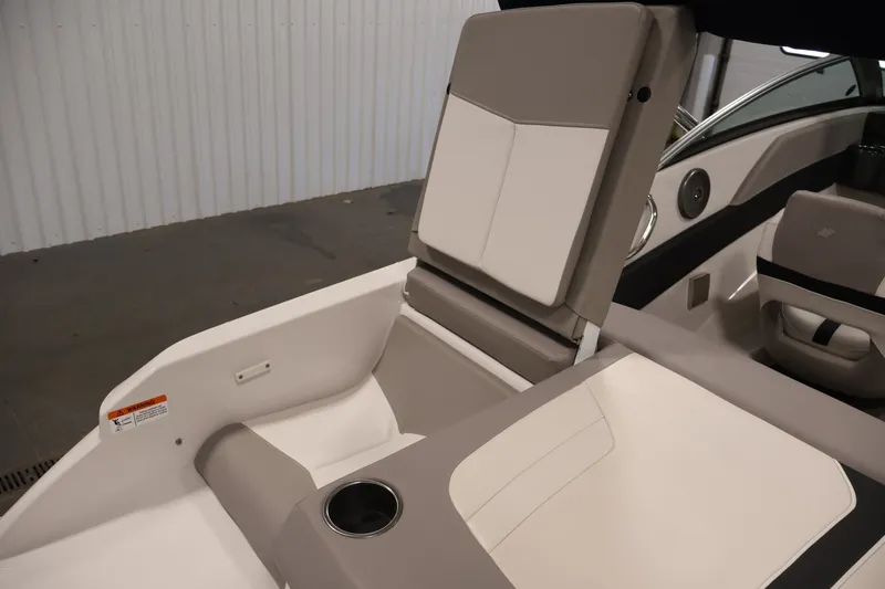 Slide: The Image of 2017 Four Winns H190 boat interior with beige seating and cup holder. - 44