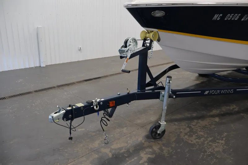 Slide: The Image of 2017 Four Winns H190 boat on trailer in indoor storage facility. - 52