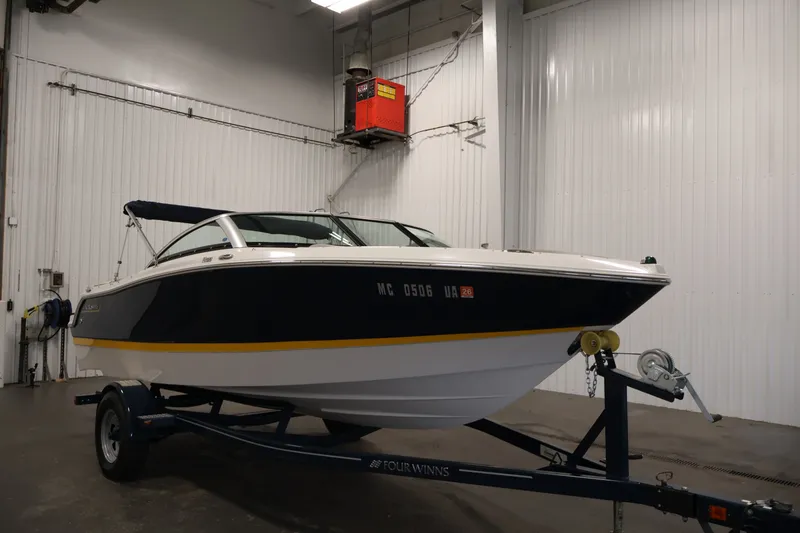 Slide: The Image of 2017 Four Winns H190 boat on trailer in indoor storage facility. - 3