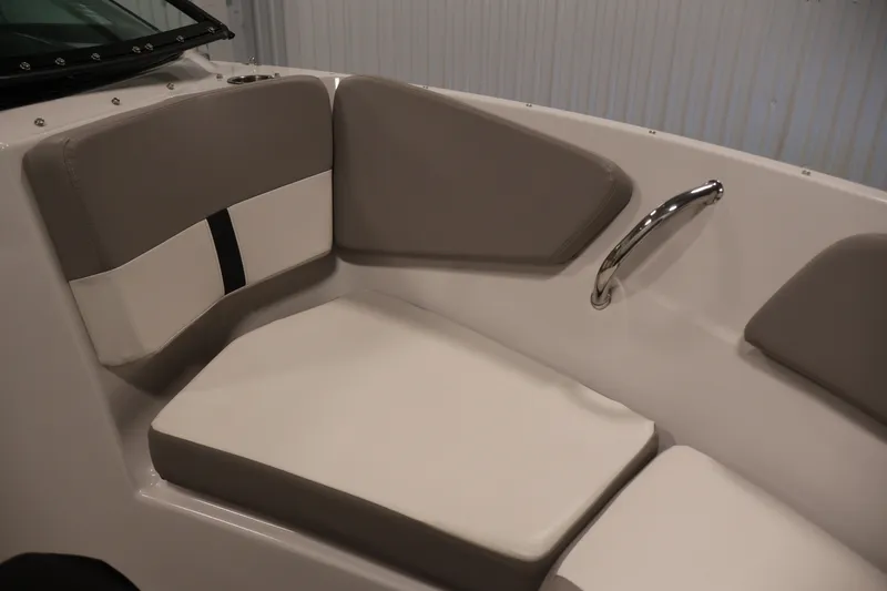 Slide: The Image of Interior seating of 2017 Four Winns H190 boat, featuring cushioned seats and a metal handrail. - 13