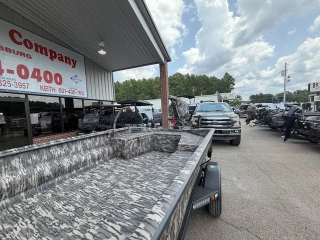 Slide: The Image of A 2026 Havoc 1756 MSTC boat on a trailer outside a dealership. - 7