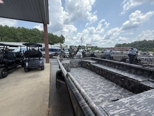 Slide: The Image of A 2026 Havoc 1756 MSTC boat is parked next to other vehicles on a lot. - 21