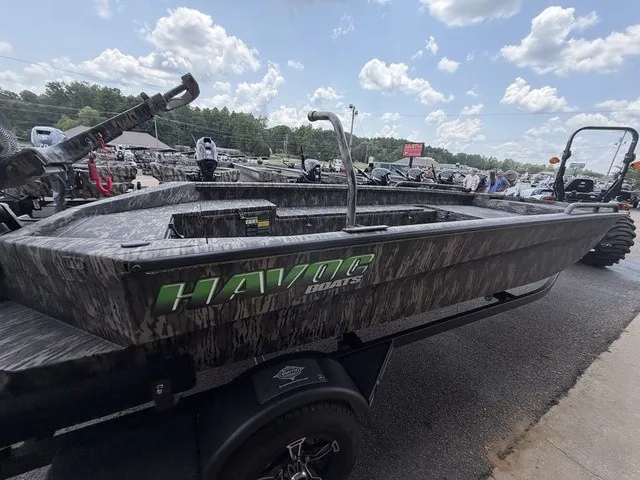 Slide: The Image of A 2026 Havoc 1756 MSTC boat with a camouflage design is on a trailer. - 14