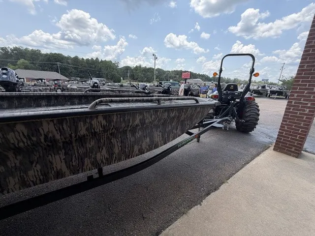 Slide: The Image of A 2026 Havoc 1756 MSTC boat on a trailer in an outdoor setting. - 16