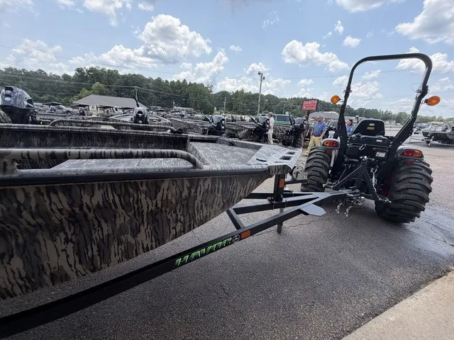 Slide: The Image of A 2026 Havoc 1756 MSTC boat is being towed by a tractor on a trailer. - 17