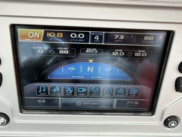 Slide: The Image of The image shows a digital dashboard of a 2018 Tigé R23 boat with various displays. - 15