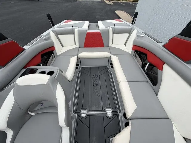 Slide: The Image of The image shows the interior of a 2018 Tigé R23 boat with gray and red seating. - 20