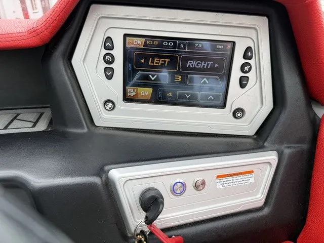 Slide: The Image of The image shows a control panel with a digital display and buttons in a boat. - 14