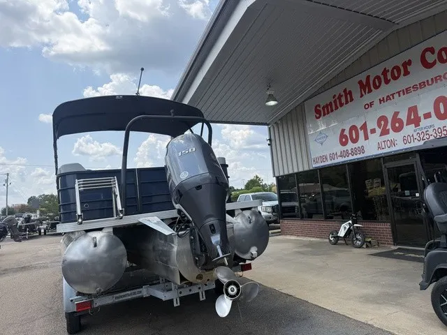 Slide: The Image of A 2022 Veranda Vista View 22RC pontoon boat on a trailer outside a building. - 13