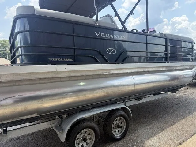 Slide: The Image of A 2022 Veranda Vista View 22RC pontoon boat on a trailer, featuring a black railing. - 8