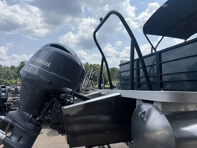 Slide: The Image of A 2022 Veranda Vista View 22RC with a Yamaha outboard motor, captured outdoors under a cloudy sky. - 10