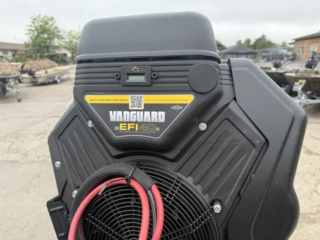 Slide: The Image of Close-up of a Vanguard EFI 40 engine mounted on a boat outdoors. - 8