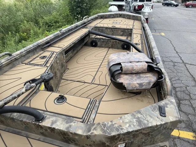Slide: The Image of Excel 175 SWF4 Legacy 2026: Camouflage-patterned boat with spacious deck and seating area. - 7