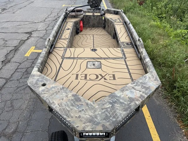 Slide: The Image of The image shows an Excel 175 SWF4 Legacy boat from 2026 with a camouflage design. - 4
