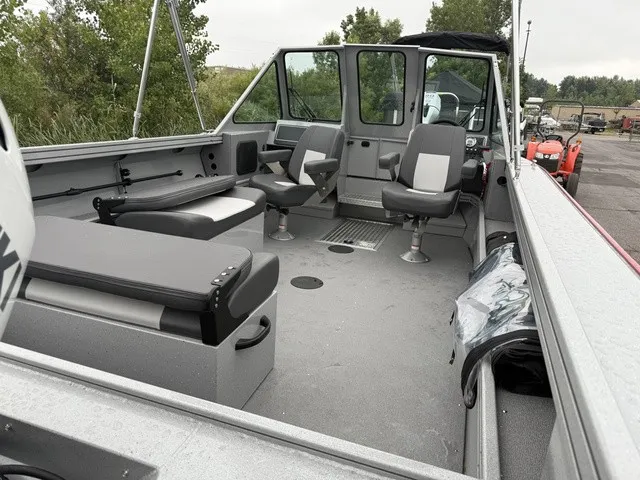 Slide: The Image of The image shows the interior of a 2027 Smoker Craft Phantom 20 X2 boat with gray seating. - 8