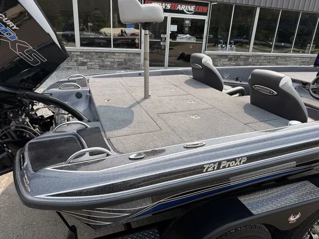 Slide: The Image of The image shows a 2022 Phoenix 721 ProXP boat with a gray deck and two seats. - 5