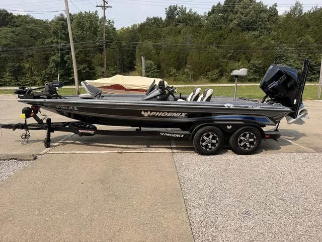 Slide: The Image of A gray 2022 Phoenix 721 ProXP boat on a trailer in an outdoor setting. - 20