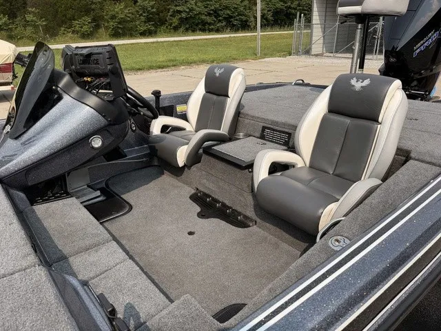 Slide: The Image of The image shows the cockpit of a 2022 Phoenix 721 ProXP boat with two cushioned seats. - 15
