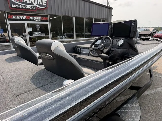 Slide: The Image of The image shows the cockpit of a 2022 Phoenix 721 ProXP boat with modern instruments. - 6
