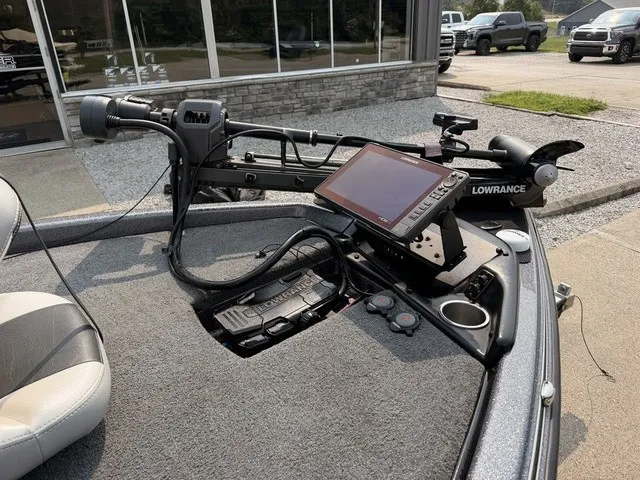Slide: The Image of The image shows the cockpit of a 2022 Phoenix 721 ProXP boat with a Lowrance fish finder. - 11