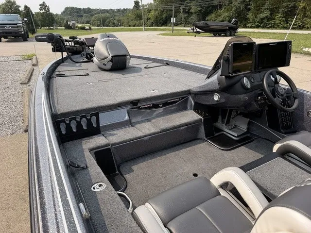 Slide: The Image of The image shows the cockpit of a 2022 Phoenix 721 ProXP boat with gray interior. - 18