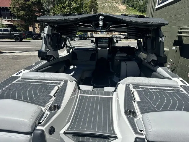Slide: The Image of The image shows the interior of a 2022 Nautique Super Air Nautique G23 Paragon with luxurious seating and modern design. - 4