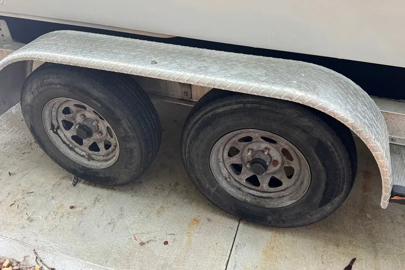 Slide: The Image of Dual wheels with metal fender on a 1997 Citation Seapro 220 Aquadek trailer. - 10