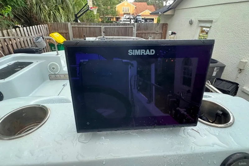 Slide: The Image of Simrad display on 1997 Citation Seapro 220 Aquadek boat, outdoor setting. - 20