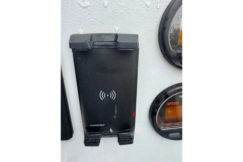 Slide: The Image of Boat dashboard with Scanstrut wireless charger on a 1997 Citation Seapro 220 Aquadek. - 21