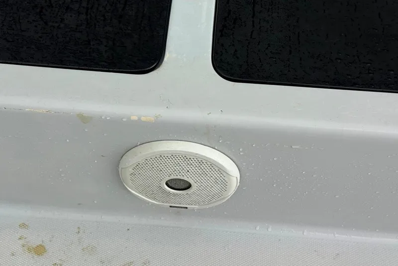 Slide: The Image of Speaker on 1997 Citation Seapro 220 Aquadek boat, with visible water droplets. - 17