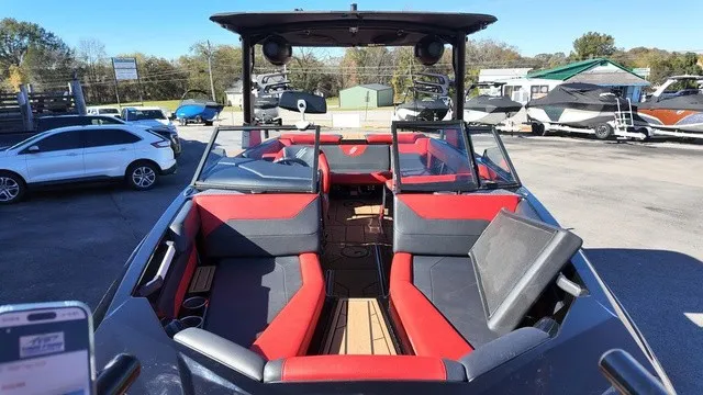 Slide: The Image of The image shows a 2023 ATX Boats 22 S model with red and black seating. - 6