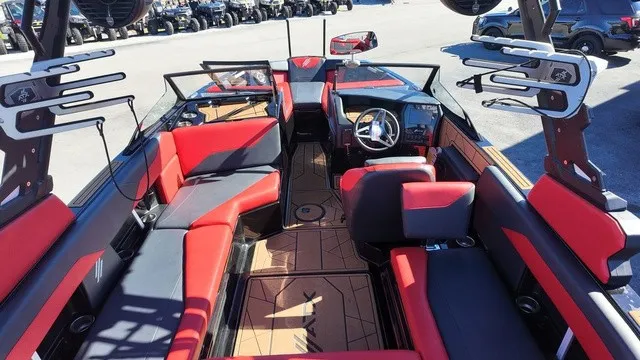 Slide: The Image of The image shows the interior of a 2023 ATX Boats 22 S with red and black seating. - 10
