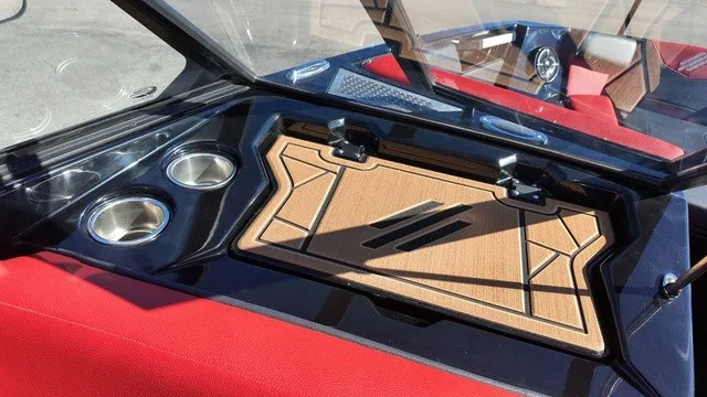 Slide: The Image of The image shows the cockpit of a 2023 ATX Boats 22 S with red seats and cup holders. - 18