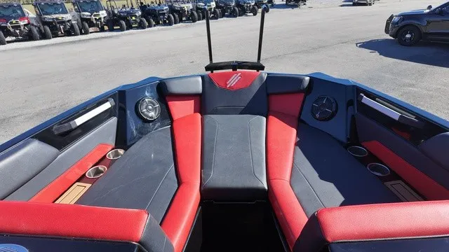 Slide: The Image of The image shows the cockpit of a 2023 ATX Boats 22 S with red and black seating. - 7