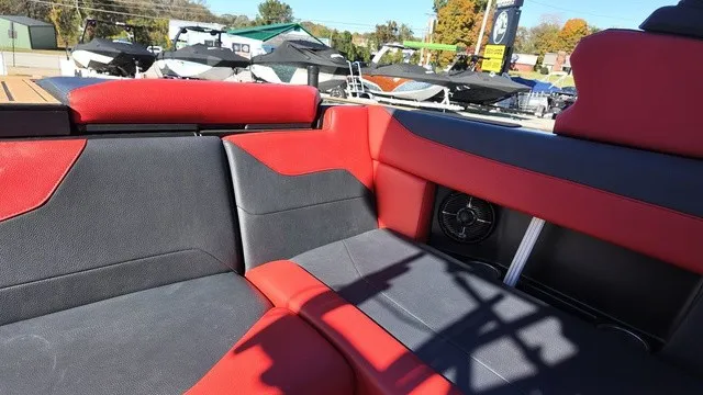 Slide: The Image of The image shows the interior of a 2023 ATX Boats 22 S with red and gray seating. - 12
