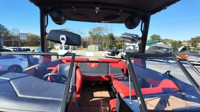 Slide: The Image of The image shows a 2023 ATX Boats 22 S model. It features red and black seating and a modern dashboard. - 8