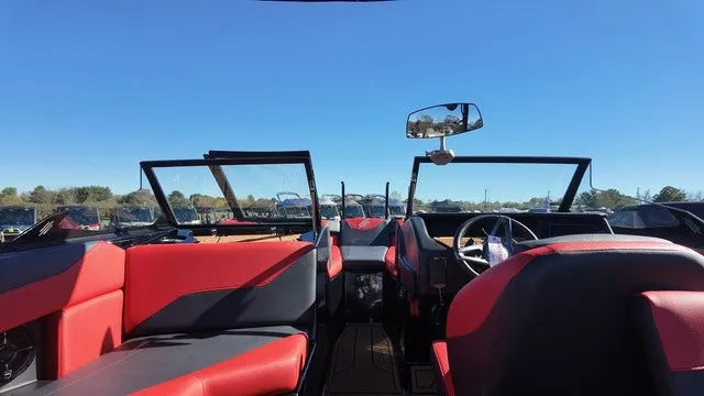 Slide: The Image of The image shows the interior of a 2023 ATX Boats 22 S with red and black seating. - 9