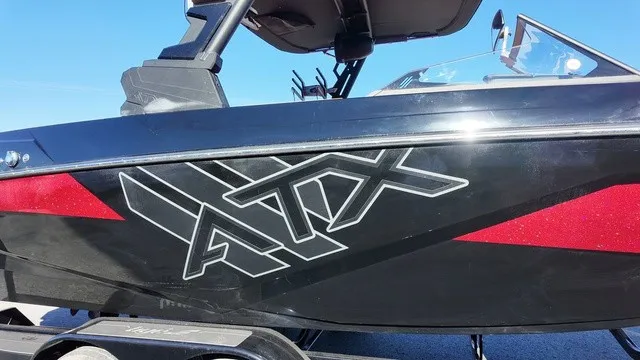Slide: The Image of A black 2023 ATX Boats model 22 S with bold logo and red accents. - 20
